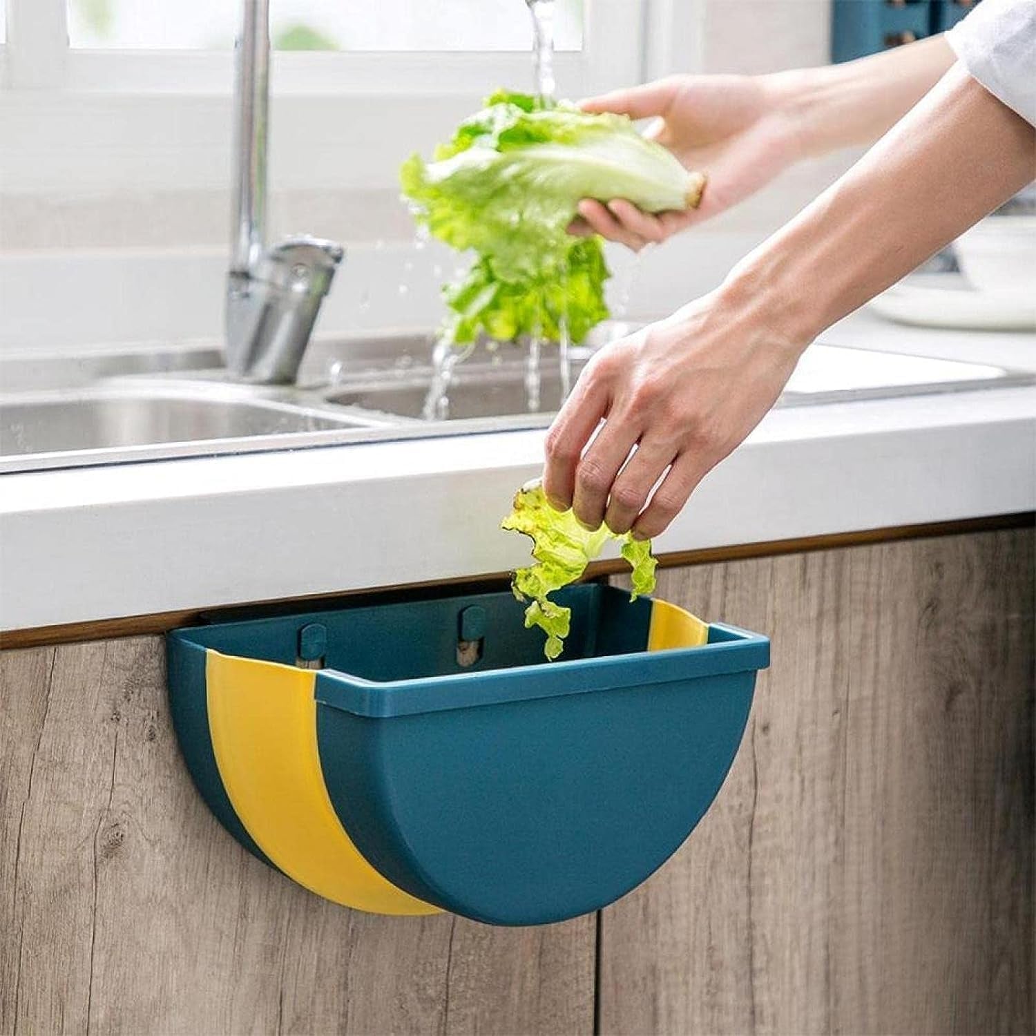 Space-saving wall-mounted trash can with adhesive hook. Space-saving wall-mounted trash can with adhesive hook.